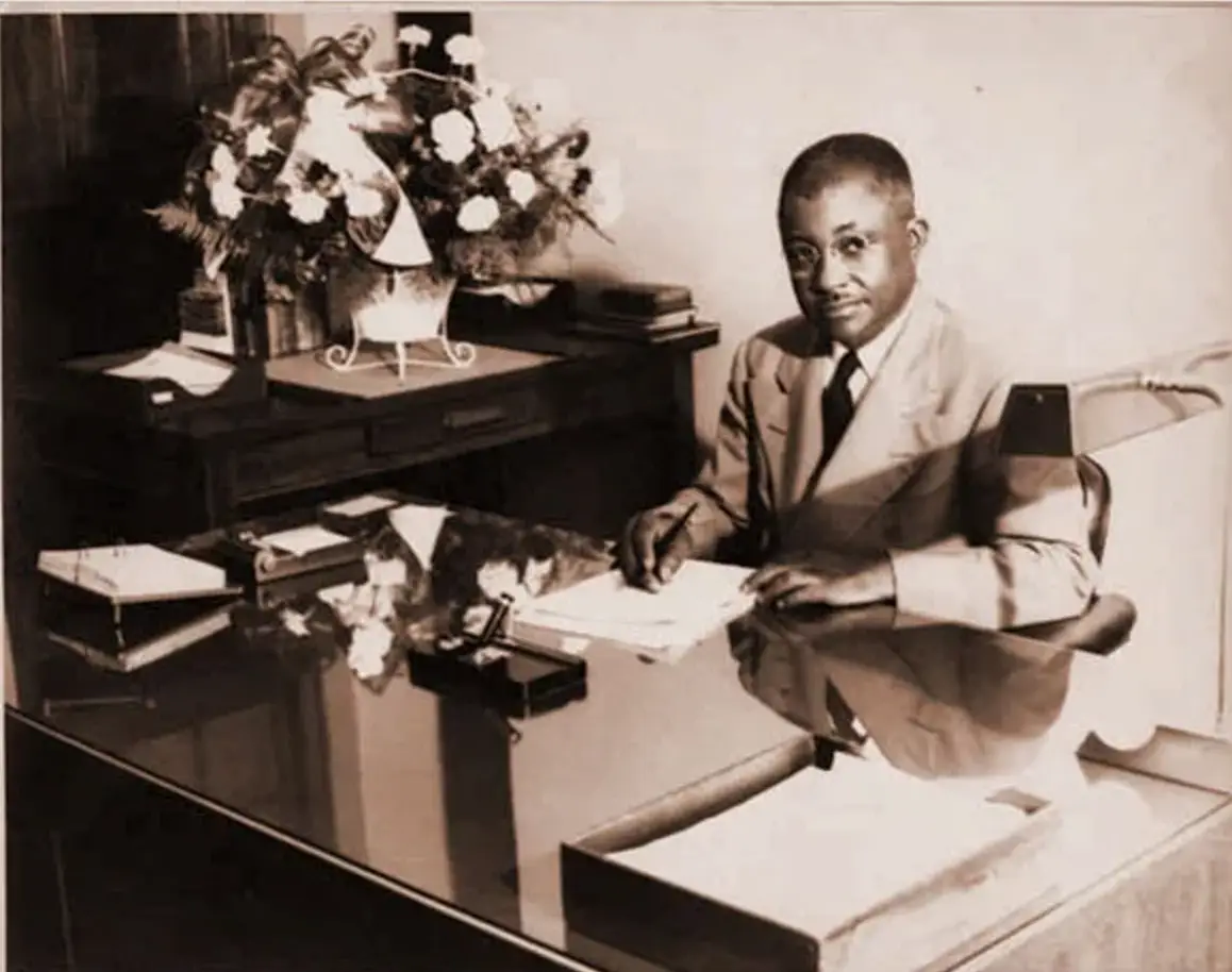 News 3 Dr. JF Drake seated at a desk