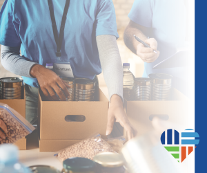 nonprofit workers filling boxes with canned food